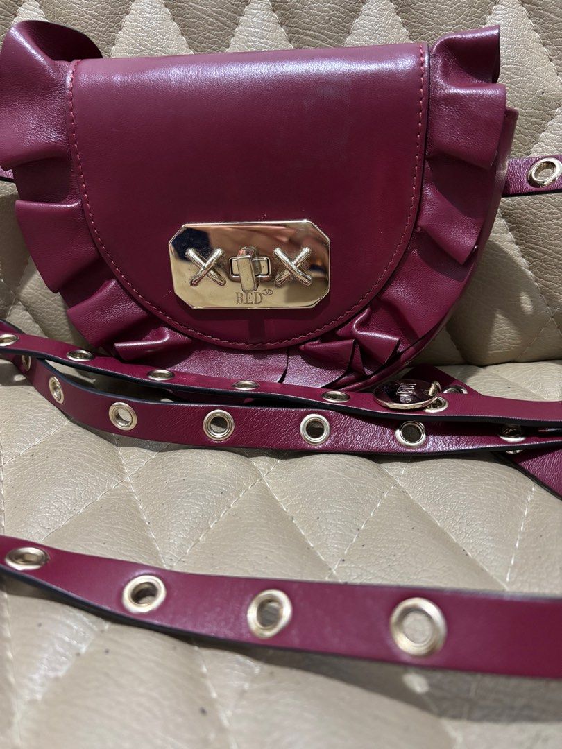 VALENTiNO RED Ruffle Bag (Category: Luxury Bags & Wallets) located in Quezon City. Submitted by dmanille (Listing ID 1369659479, Image 1). Description: ‼️SALE‼️ 2K Last Price Authentic RED by VALENTINO Ruffle Bag (Waist bag/Belt Bag, Cossbody Bag) CAN BECOME A BUMBAG ADJUSTABLE SHOULDER STRAP BURGUNDY MADE IN ITALY SPRING-SUMMER MATERIALS: 100% CALF LEATHER ✅Very cute mini bag.