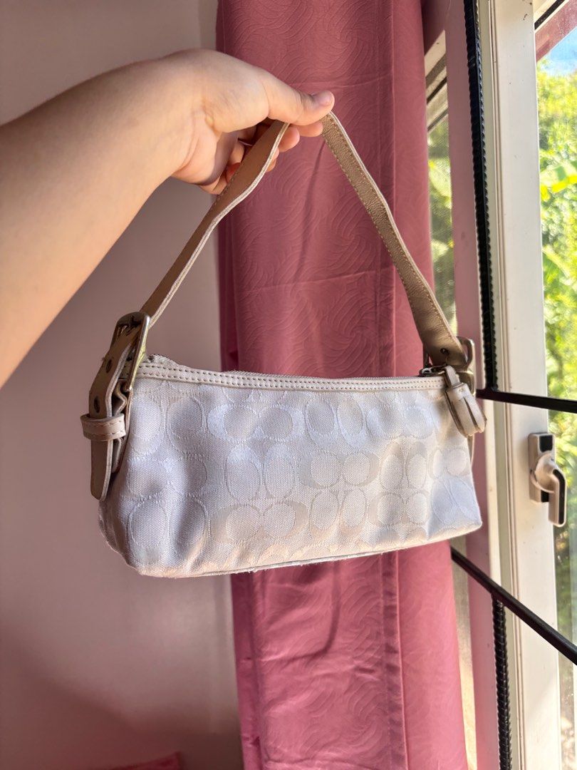 white coach baguette bag (Category: Shoulder Bags) located in Paranaque City. Submitted by lovedbydevi (Listing ID 1369501170, Image 1). Description: slightly nego see minor flaws in last slide.