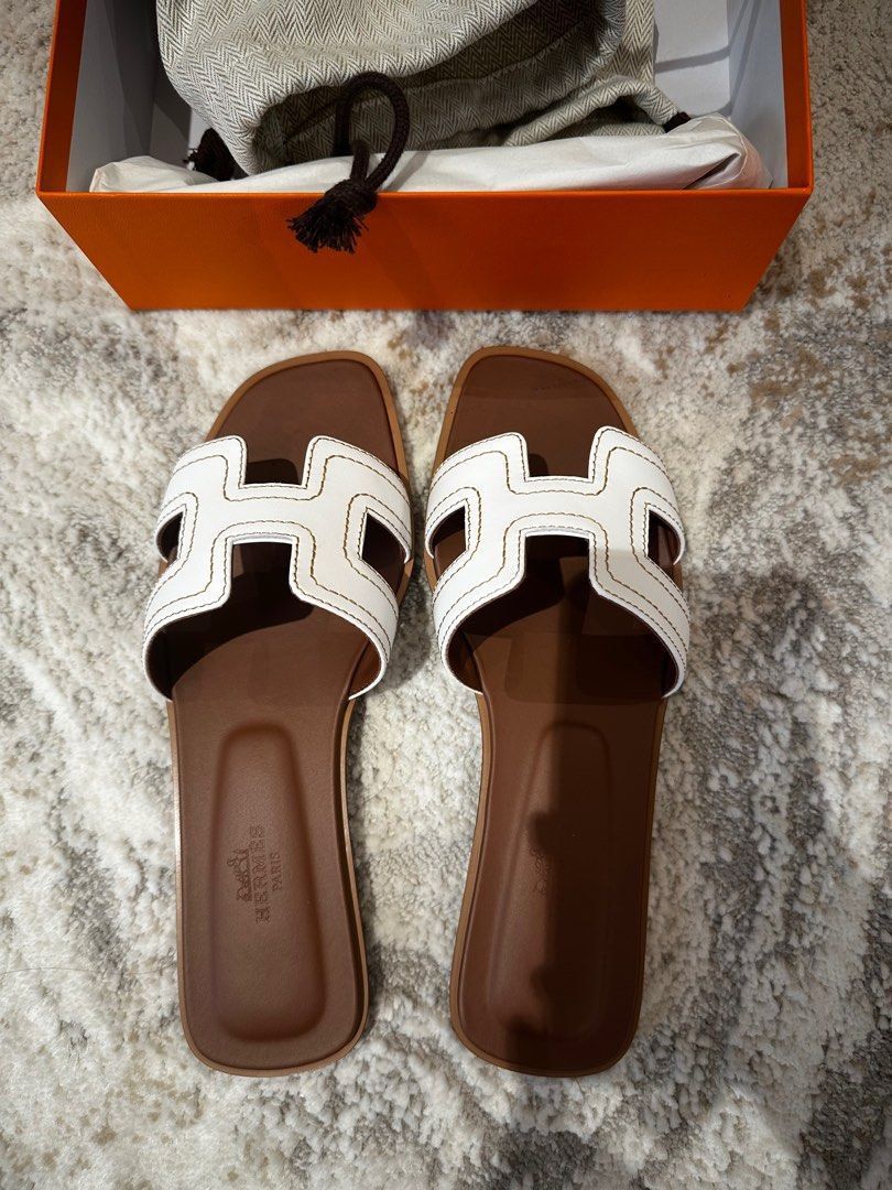 Authentic Hermes Oran Sandals White (Category: Sneakers & Footwear) located in Quezon City. Submitted by breakmyfashion (Listing ID 1369853208, Image 1). Description: Comes in full set with receipt, box, paperbag and dust bag. .