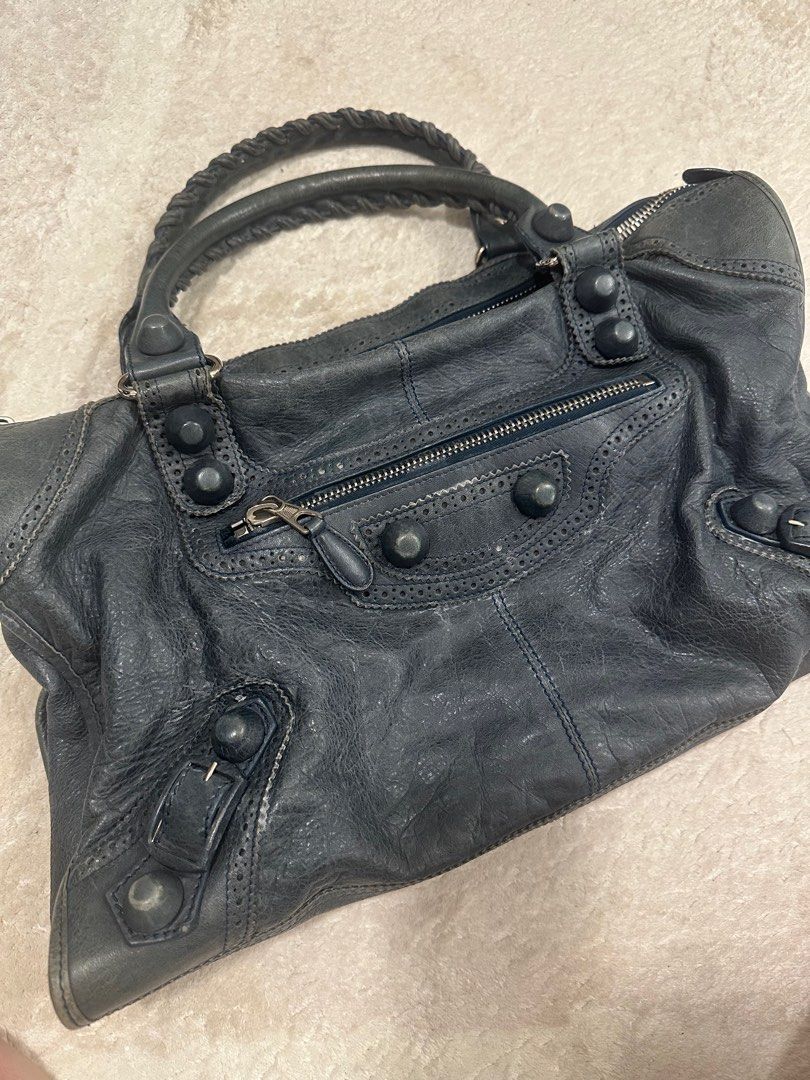 Balenciaga Work City Bag (Category: Bags & Wallets) located in Singapore. Submitted by coffeelover2233 (Listing ID 1369737713, Image 2). Description: In dark green 44x28x17 cm In good condition, slight wear on leather Comes with Dustbag.