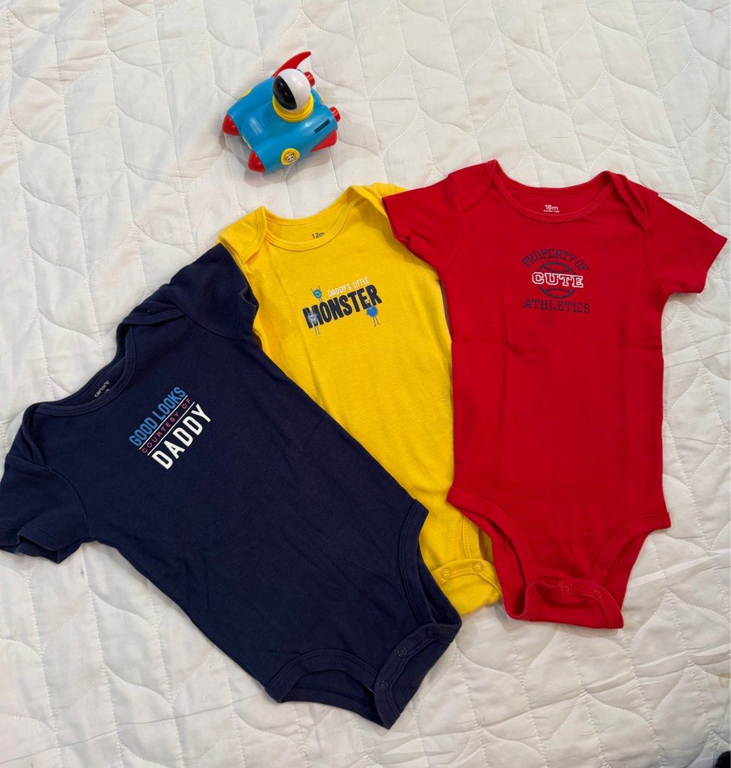 Carters Onesies Set of 3 (Category: Babies & Kids Fashion) located in Talisay. Submitted by retrobags (Listing ID 1369766447, Image 1). Description: Very good used condition. Lightly use especially the red & yellow once lang nasuot. No damage or flaws po. Can fit 12-18 mos po..