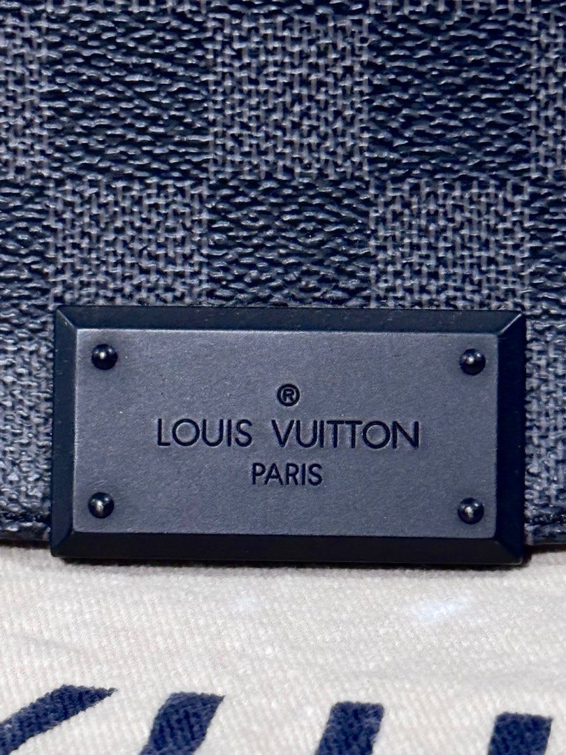LV Graphite Messenger Bag (Category: Luxury Bags & Wallets) located in Quezon City. Submitted by christineboller (Listing ID 1369873592, Image 3). Description: LV Graphite Daniel Messenger Bag in 9.5/10 condition. Magnetic flap closure, silver hardware. CA4193 (Year 2013). No rubs/scratches on edges. Clean interior. With LV dustbag for only P52k.