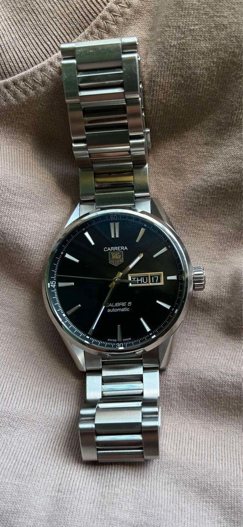 Tag Heuer Carrera Day Date Caliber 5 Automatic (Category: Luxury Watches) located in Makati City. Submitted by wherebrokeboysgo (Listing ID 1369715204, Image 2). Description: For sale or for trade! Tag Heuer Carrera Day Date Caliber 5 Automatic WAR201A 41mm With box, manual, card, extra links PHP 77,000. slightly negotiable.