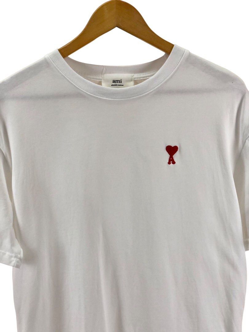 Ami white tee (Category: Luxury Apparel) located in Manila. Submitted by 12essentials (Listing ID 1369917196, Image 2). Description: 📌 Excellent Condition 📌 M on tag 📌 Length 27.5’ Width 21’.