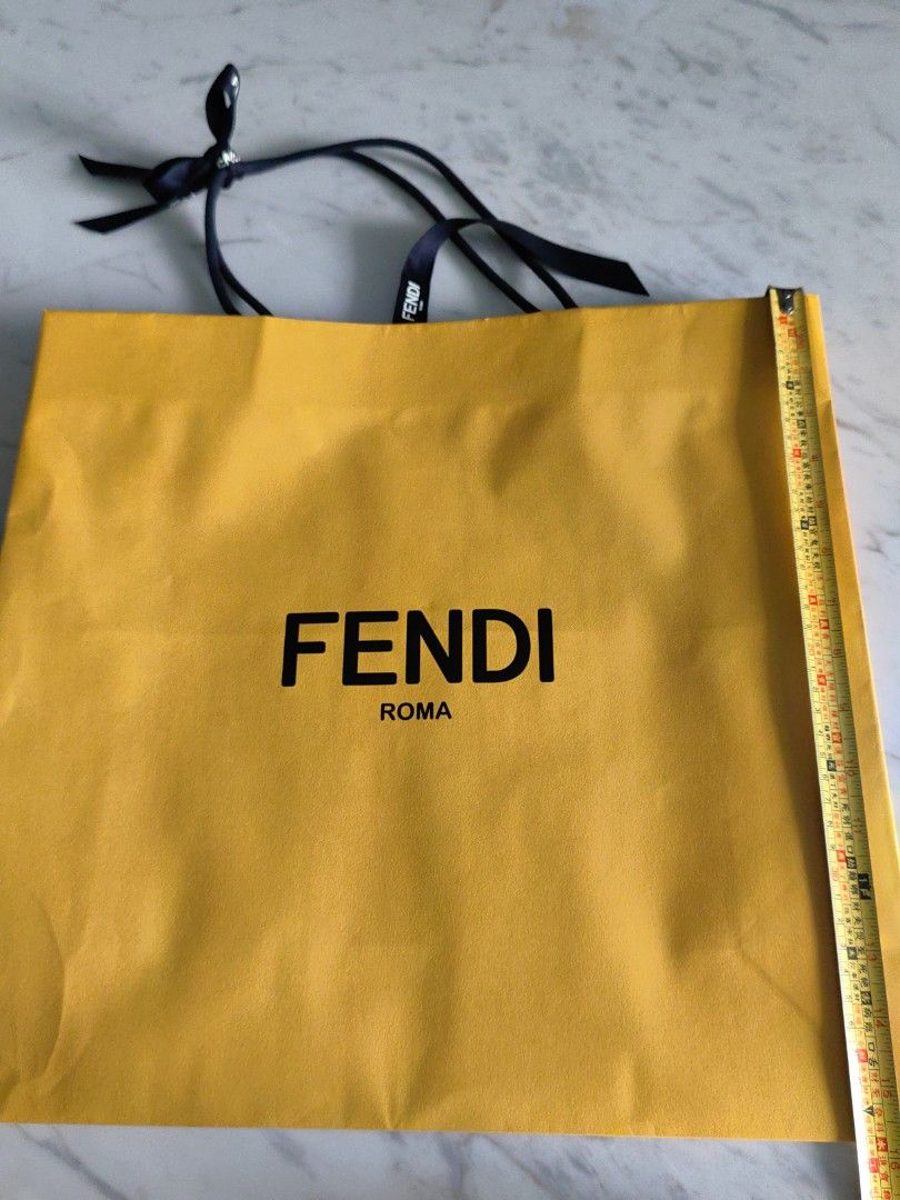 Fendi paperbag (Category: Luxury Bags & Wallets) located in Makati City. Submitted by kruelscloset (Listing ID 1369888506, Image 1). Description: 16x16in Fendi paperbag. Fits bag and shoes.
