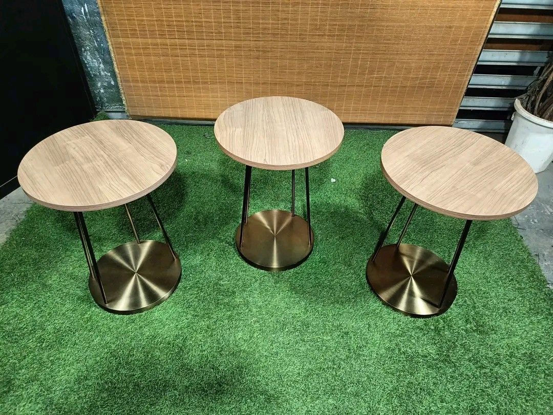 Modern Elegant Round Side (Category: Chairs) located in Quezon City. Submitted by matetdevis13 (Listing ID 1369989930, Image 2). Description: Modern Elegant Round Side / Coffee Table Thick Solid Wood Top, Brass Frame & Base Price : 5000 each; 12,500 for 3 18 inches diameter, 24 inches tall In VERY good condition Code HOMEBOSS.