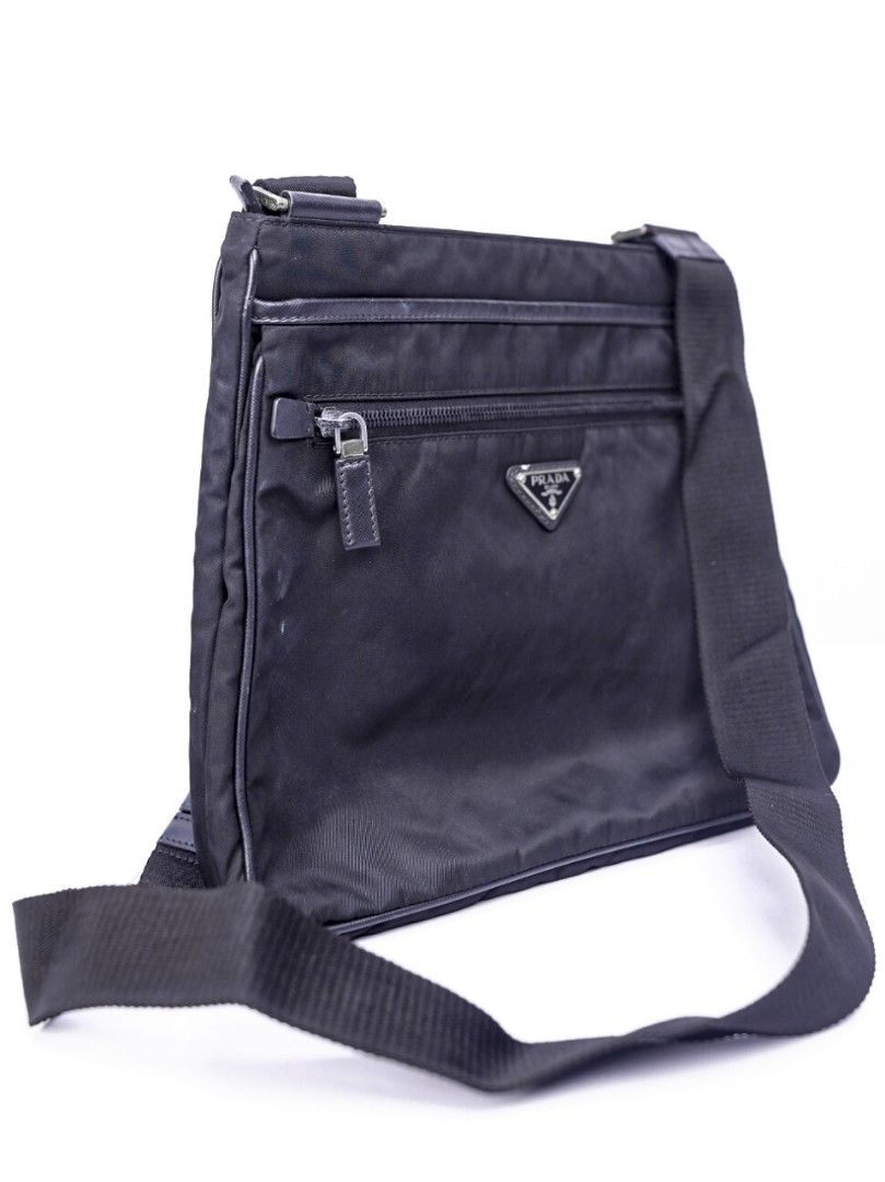 Prada Sling Bag for Men Black Nylon (Category: Luxury Bags & Wallets) located in Pasig City. Submitted by clothesandthings_ (Listing ID 1369832616, Image 3). Description: Authentic Retail price at 60,000 Bag only No functional issues Aesthetic 6/10 signs of normal use.