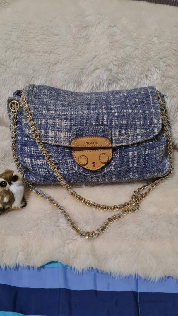 Prada Tweed Chain Flap Shoulder bag (Category: Luxury Bags & Wallets) located in Quezon City. Submitted by lix12 (Listing ID 1369928236, Image 1). Description: ❣️💯 Authentic ❣️Limited style ❣️Prada Avio (denim) large tweed flap bag ❣️Calfskin embossed Prada logo under flap with cuoio magnetic snap closure ❣️Interior: suede lining ❣️3 inner pockets, 1 zipper compartment ❣️1 exterior compartment ❣️Measurements : 36.5 cm L x 21 cm H x 12.5 cm W ❣️M