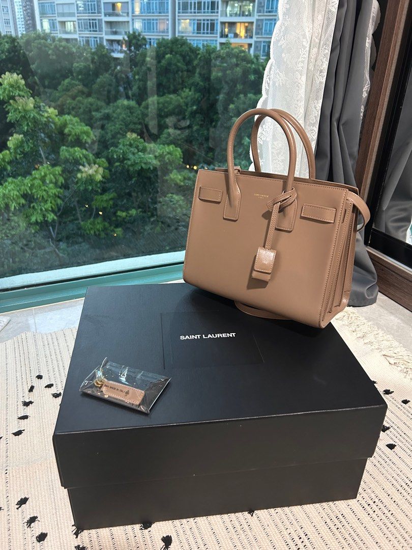 SAC DE JOUR IN SMOOTH LEATHER Small in Taupe (Category: Bags & Wallets) located in Singapore. Submitted by kgo49 (Listing ID 1327919074, Image 2). Description: Brand new like SAC DE JOUR IN SMOOTH LEATHER Purchased in Nov 2022 Used only 5-8 times Tiny scratch - from the strap chain Negotiable Box included Pick up at River Valley or Great World Need the money to buy school laptop .