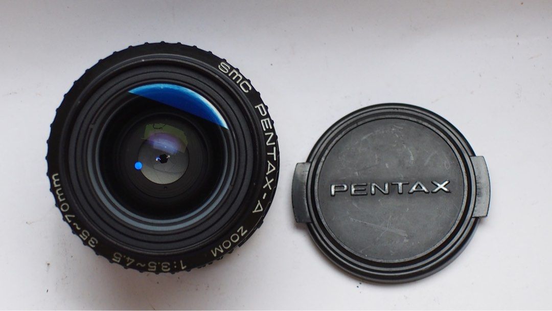 Smc Pentax -A zoom 35-70 f3.5 (Category: Lens & Kits) located in Las Pinas. Submitted by film101 (Listing ID 1369975813, Image 2). Description: SMC pentax -A zoom 35-70 f3.5-4.5 Inclusions:lens cap Good features macro lens Compact Super multi coated Focusing smooth 35-50-70 with lens guide Lens condition No haze No fungus Focusing smooth Apert snappy Good glass .