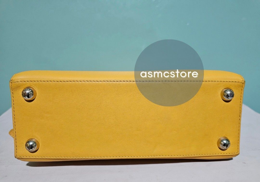 Strathberry Backpack in Yellow (Category: Luxury Bags & Wallets) located in Marikina City. Submitted by asmcstore (Listing ID 1369989290, Image 3). Description: Strathberry Backpack in Yellow Style is already sold out Made in Spain There are some cracks on the rubber linning as seen on photo Length: 31 cm Width: 27 cm Depth: 9 cm **These are VINTAGE/PRELOVED bags signs of usage might be present** **Bags are cleaned and conditioned**.