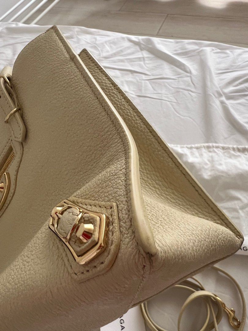 Balenciaga A4 Papier Tote Bag (Category: Luxury Bags & Wallets) located in Santa Cruz. Submitted by beautsbees (Listing ID 1366896173, Image 3). Description: Light Yellow. Gold Hardware. Comes with strap, dustbag, card and mirror. Very functional bag. Fits a lot of stuff. Can be worn as top handle or crossbody. Same size as Louis Vuitton On the Go BB. In excellent condition. With unnoticeable flaws. .