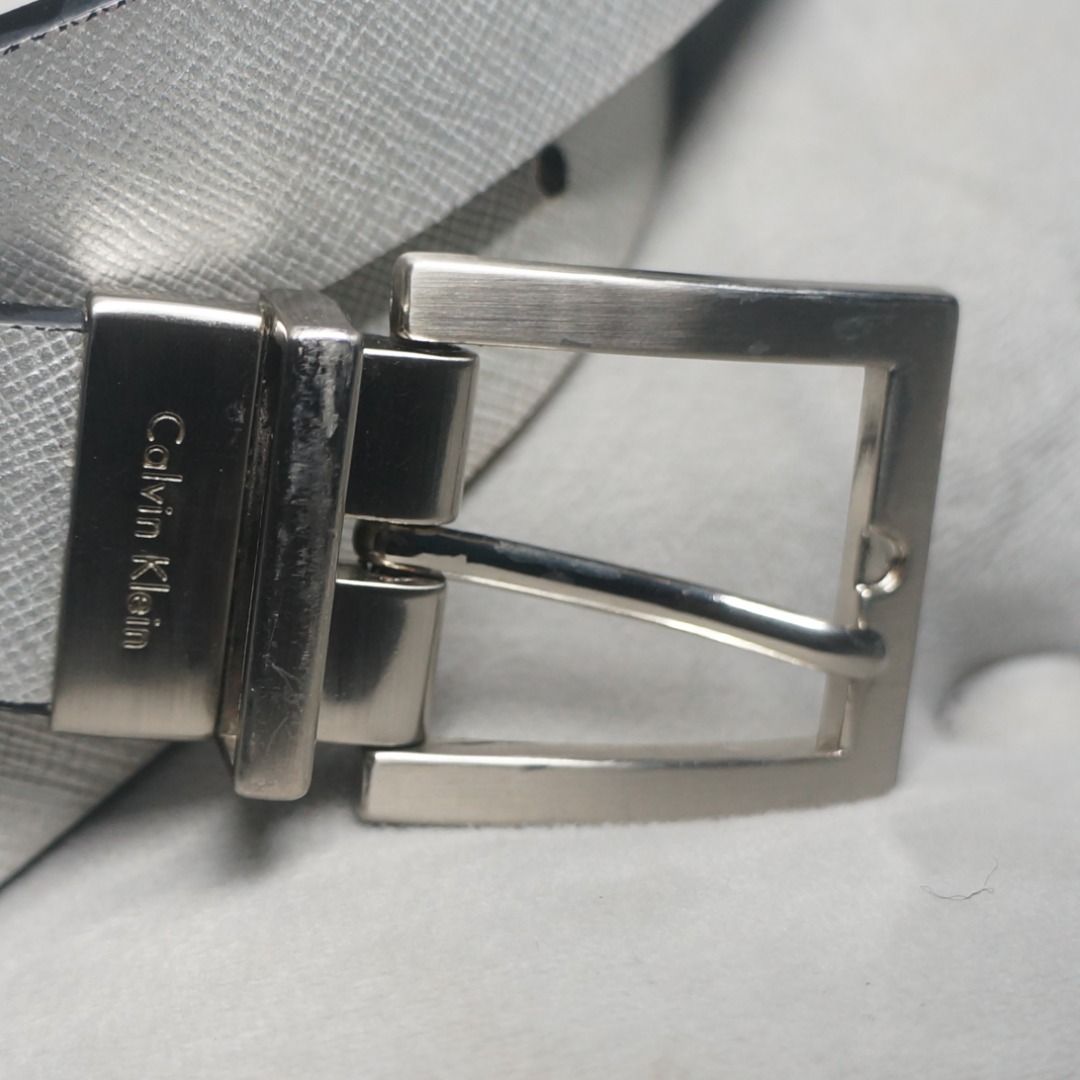 Calvin Klein Silver Leather Belt (Category: Belts) located in Taguig. Submitted by tcstuff (Listing ID 1366811577, Image 2). Description: Belt Measurements: 41 in x 1.1 in First Hole: 33 in Last Hole: 37 in Newly cleaned, conditioned, polished leather. Newly polished metal hardware. Repainted bottom layer (White part). Payment Method: GCash or GoGo Express COD.