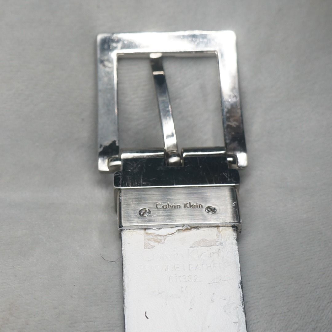 Calvin Klein Silver Leather Belt (Category: Belts) located in Taguig. Submitted by tcstuff (Listing ID 1366811577, Image 3). Description: Belt Measurements: 41 in x 1.1 in First Hole: 33 in Last Hole: 37 in Newly cleaned, conditioned, polished leather. Newly polished metal hardware. Repainted bottom layer (White part). Payment Method: GCash or GoGo Express COD.