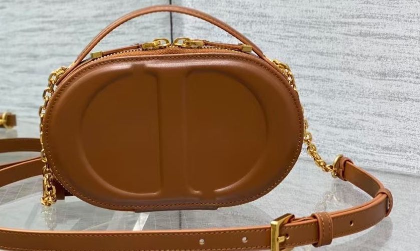 DIOR CD Signature / Detachable & Adjustable Strap / Embossed Logo / Calfskin Leather / Camera Crossbody Shoulder Bag / Women's / Brown (Category: Cross-body Bags) located in Singapore. Submitted by elsepastuc76332 (Listing ID 1366829279, Image 1). Description: .