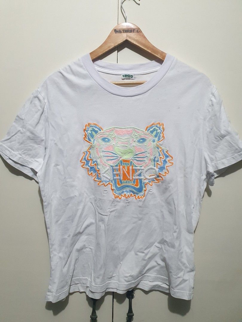 Kenzo Paris Multi Color Logo White Shirt (Category: Luxury Apparel) located in San Fernando. Submitted by bobcollection (Listing ID 1366732892, Image 1). Description: Kenzo Paris Shirt * complete tags * best fit medium to large * 21 x 25.5 inches * 9/10 color rate * EXCELLENT CONDITION sa design * issue - stains 📌 Color may vary due to lighting. 📌 All items are need wash. 📌 strictly no return to seller. 📌 ALL ITEMS ARE NEGOTIABLE. Offer lng p
