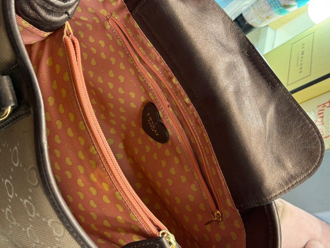 Lovcat (Category: Luxury Bags & Wallets) located in Cebu City. Submitted by dear.ondee (Listing ID 1366904119, Image 3). Description: Original Lovcat Slight used Nka hologram With very nice logo “ heart” 2 compartment with small pocket & zipper Needs cleaning since it’s preloved No bakbak No open pipeline Very nice in actual Patent leather .