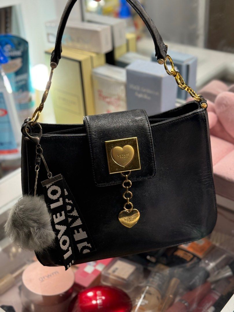 Lovcat Original (Category: Luxury Bags & Wallets) located in Cebu City. Submitted by dear.ondee (Listing ID 1366904015, Image 1). Description: Original Lovcat very cute handbag With free charms Perfect for dinner date / party or special occasions No big issue No bakbak No open pipeline Signs of used lang since preloved Small size .