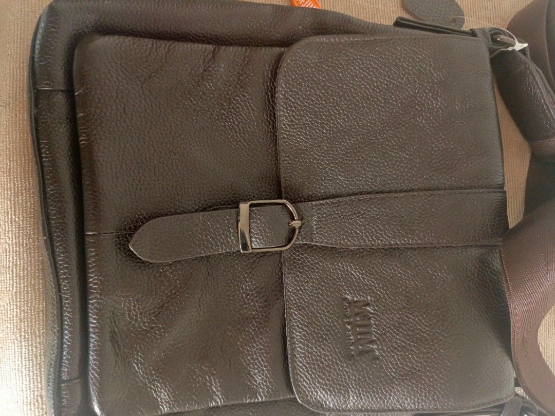 McJim Sling Bag (Category: Sling Bags) located in San Jose del Monte. Submitted by m_nshop (Listing ID 1366815081, Image 2). Description: brand new nakatago lang po hindi nagamit brown po ang color negotiable po.