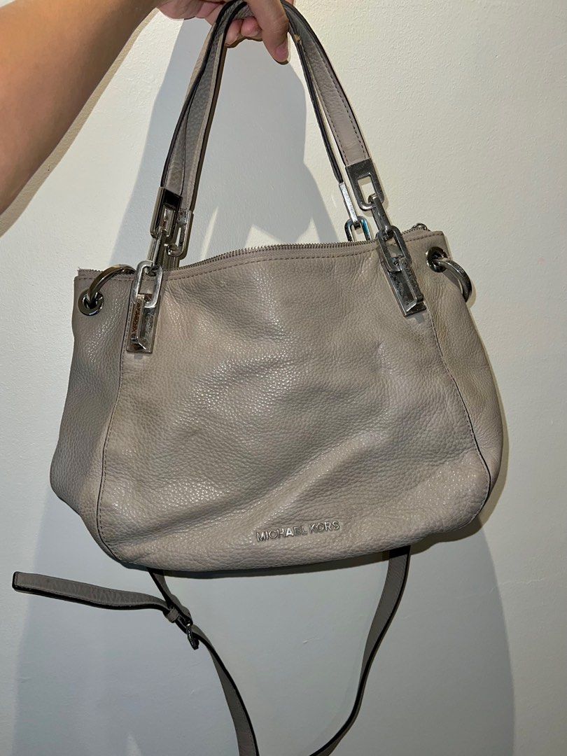 Michael Kors Gray Crossbody / Hand Bag (Category: Luxury Bags & Wallets) located in Paranaque City. Submitted by lois.ng (Listing ID 1366748463, Image 1). Description: Authentic Unnoticeable stains near metal buckles No other issues Pm for more details.