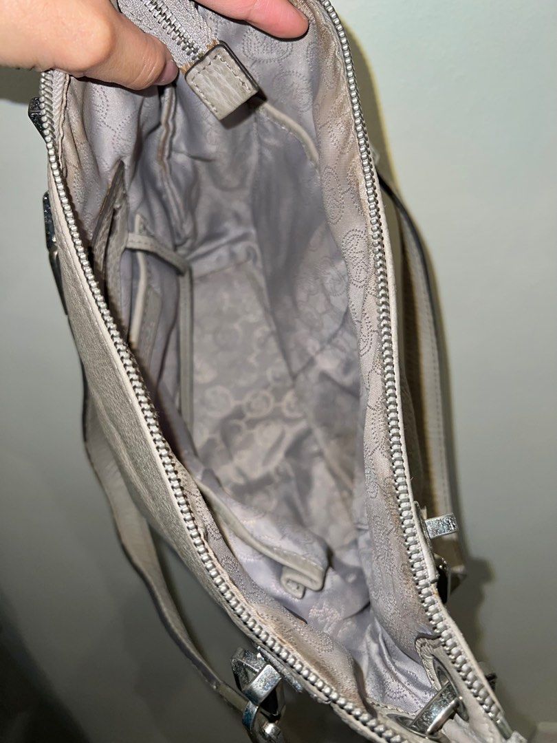 Michael Kors Gray Crossbody / Hand Bag (Category: Luxury Bags & Wallets) located in Paranaque City. Submitted by lois.ng (Listing ID 1366748463, Image 2). Description: Authentic Unnoticeable stains near metal buckles No other issues Pm for more details.