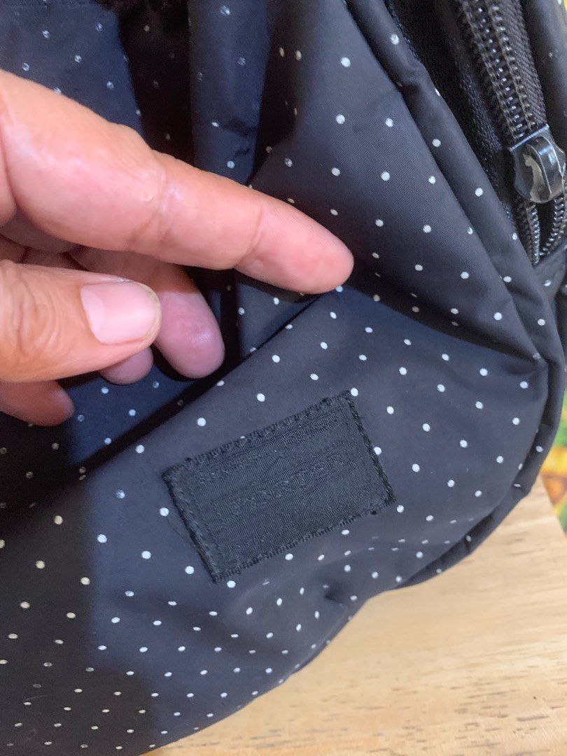 Porter Sling Bag (Category: Cross-body Bags) located in Batangas. Submitted by roams (Listing ID 1366870981, Image 2). Description: Nice pa in actual May slightly faded sa main compartment see photos na lang po Kulang ng isang puller sa side pocket Faded na rin ang name brand sa harap Just pm😊.
