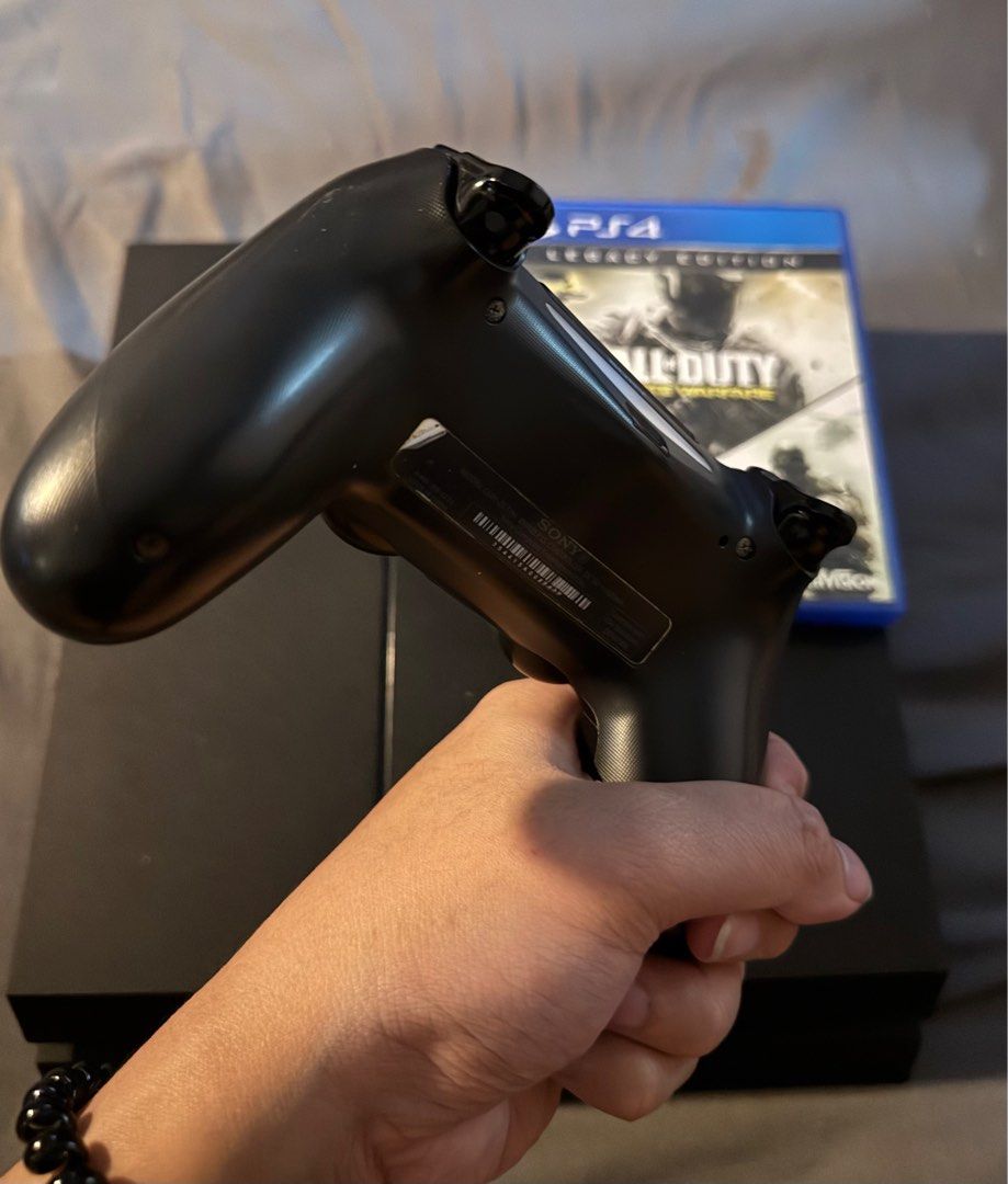 PS4 Phat 1TB + 1 controller ( 1CD) (Category: PlayStation) located in Pasig City. Submitted by robbiseraphin (Listing ID 1366907682, Image 3). Description: Review item description: • PS4 Phat 1TB + 1 original controller 1 4 CD game (latest firmware) no original box. Games: - Call of duty infinite warfare + modern warfare remastered (legacy edition) Price is = 5,500 php —————— Item location is Pasig. Unli-testing. PM if interested or message at 09