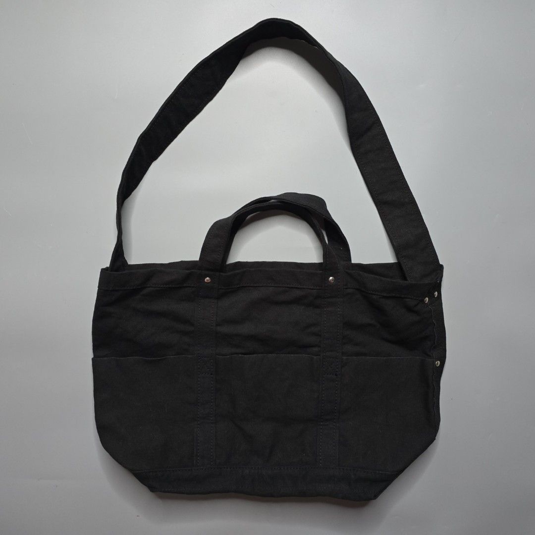 Yaeca Japan -Tool Bag - Medium (Category: Sling Bags) located in Malabon City. Submitted by buynflex (Listing ID 1366768822, Image 1). Description: Yaeca Japan - Tool Bag - Medium Measurements: H 32 x W 45 x 20 cm This bag incorporates the functional details found in old American tool bags and can be carried by hand or over the shoulder. It is made of thick cotton canvas material that changes with use. The inside is made waterproof by applying ny