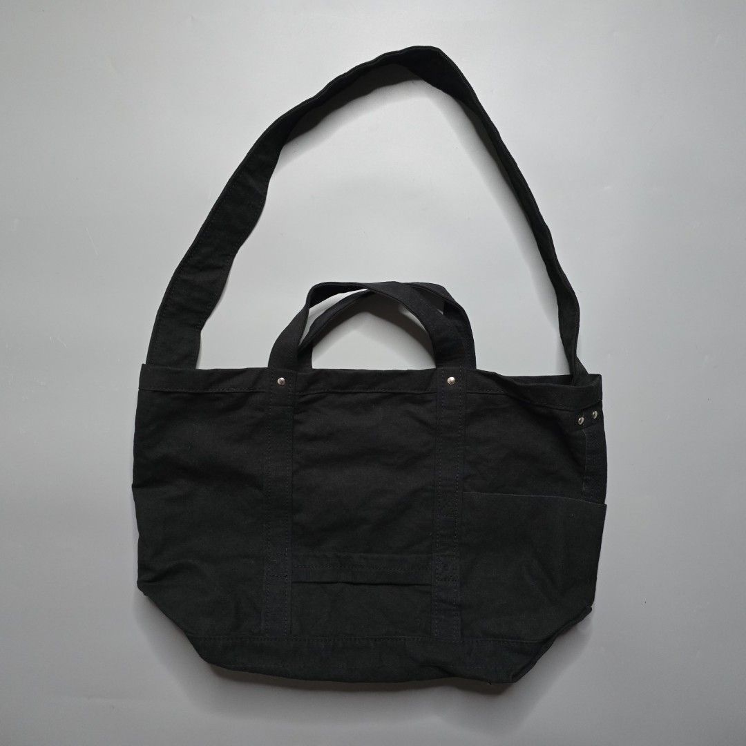 Yaeca Japan -Tool Bag - Medium (Category: Sling Bags) located in Malabon City. Submitted by buynflex (Listing ID 1366768822, Image 2). Description: Yaeca Japan - Tool Bag - Medium Measurements: H 32 x W 45 x 20 cm This bag incorporates the functional details found in old American tool bags and can be carried by hand or over the shoulder. It is made of thick cotton canvas material that changes with use. The inside is made waterproof by applying ny