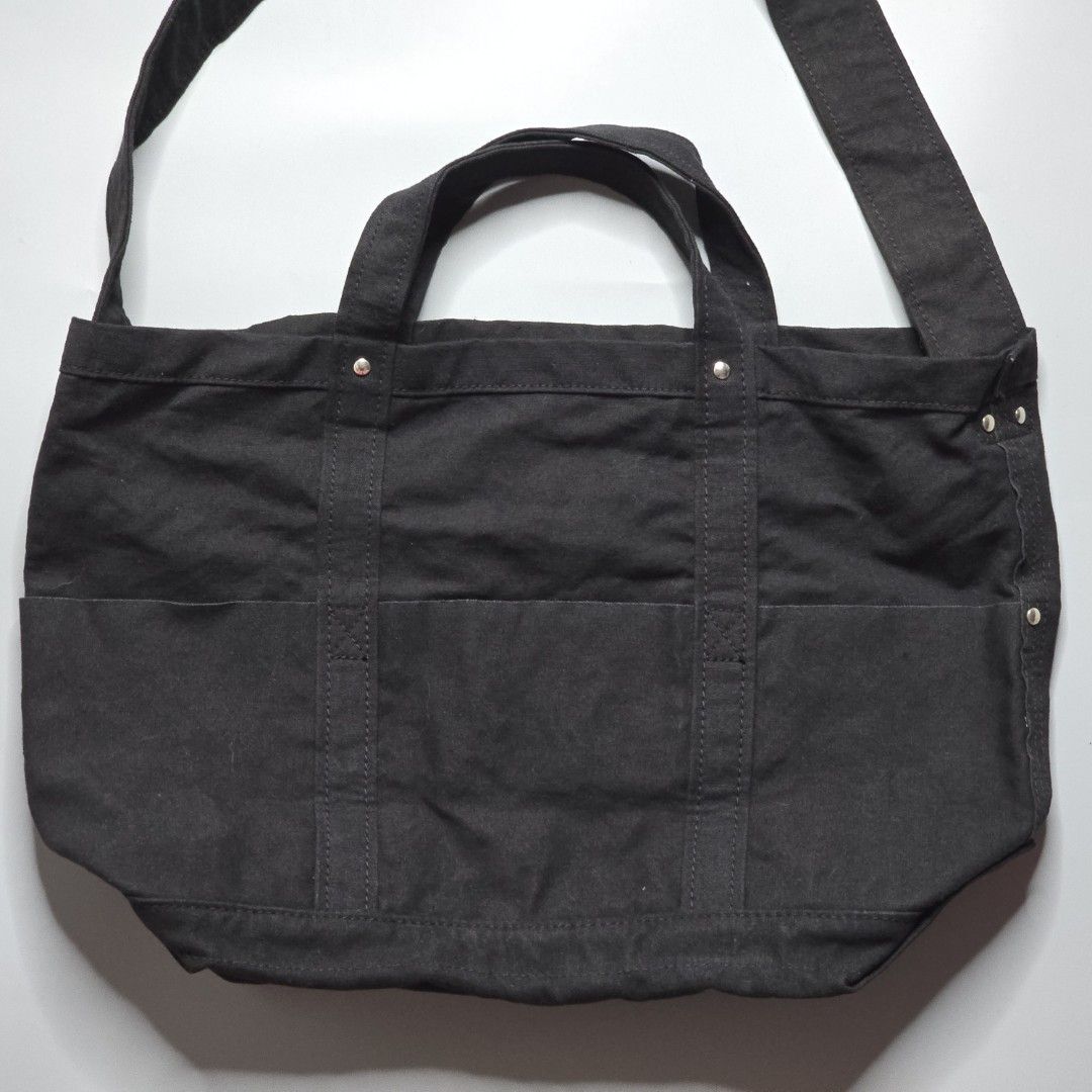 Yaeca Japan -Tool Bag - Medium (Category: Sling Bags) located in Malabon City. Submitted by buynflex (Listing ID 1366768822, Image 3). Description: Yaeca Japan - Tool Bag - Medium Measurements: H 32 x W 45 x 20 cm This bag incorporates the functional details found in old American tool bags and can be carried by hand or over the shoulder. It is made of thick cotton canvas material that changes with use. The inside is made waterproof by applying ny