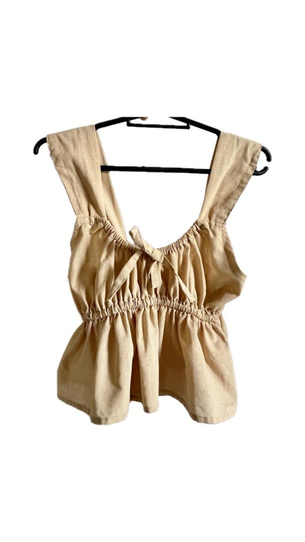 Cream/Beige Linen Peplum Top (Category: Sleeveless) located in Paranaque City. Submitted by daisyreejoyce__ (Listing ID 1370145637, Image 3). Description: For your reference, here are my measurements: Bust: 39 inches Waistline: 32 inches Arms: 12 inches Height: 5’2 Location: Bf Homes Parañaque City/Paseo Makati Mode of Delivery (same day delivery): Lalamove, Angkas Padala, Grab Express Other courier: J&T Express (with additional handling fee of 3