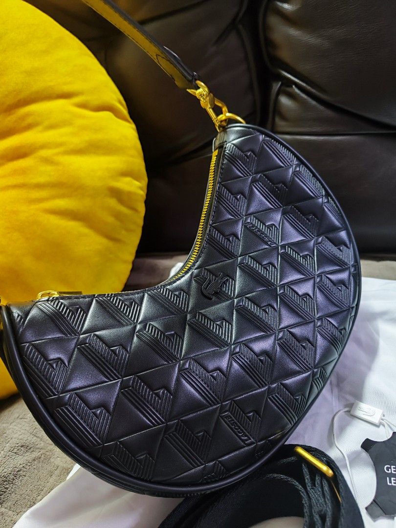 Lacoste Maheki Embossed Leather Half Moon Purse (Category: Luxury Bags & Wallets) located in Pasig City. Submitted by purpleglitters (Listing ID 1370195937, Image 2). Description: Good as new Complete inclusion, tag, dustbag, still with receipt Orig price: 12,950 Actual pics posted Can do Layaway. Pm me for inquiries.