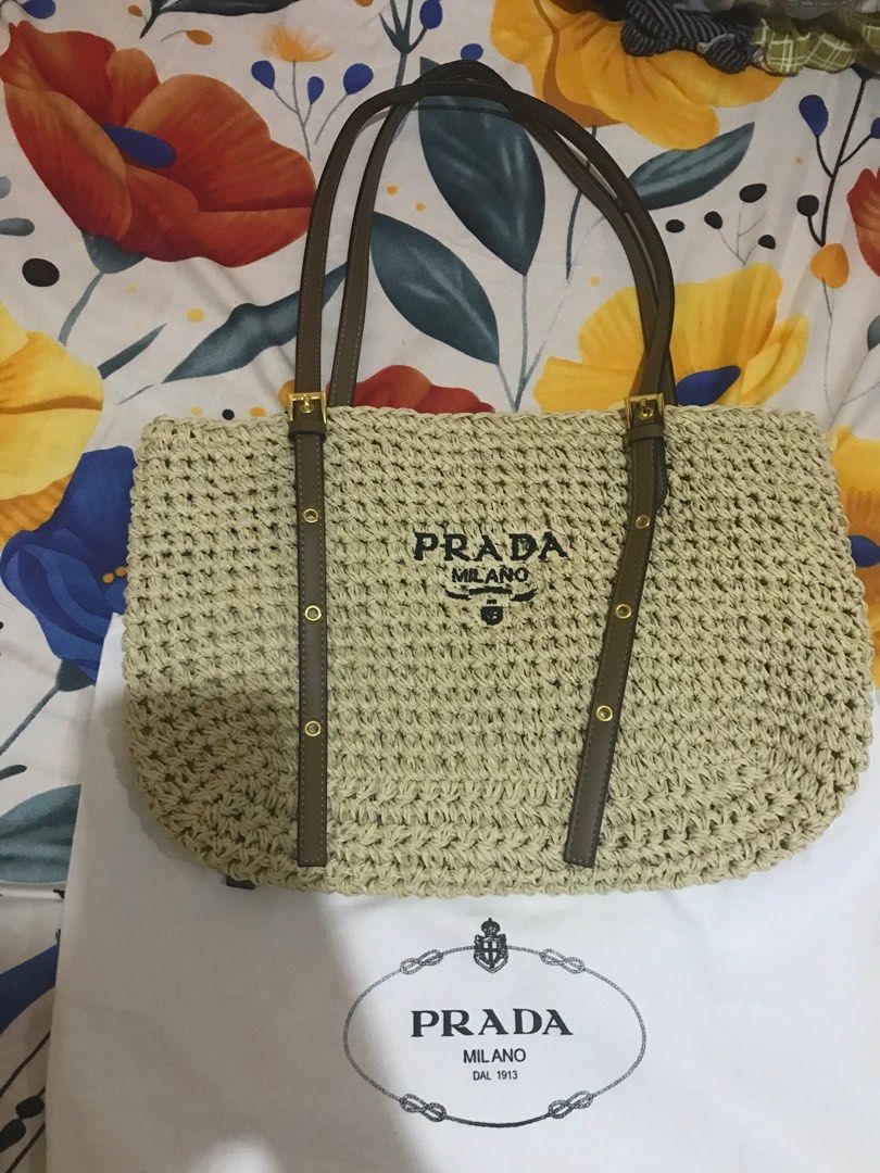 Prada beach bag (Category: Luxury Bags & Wallets) located in Taguig. Submitted by dean_cute25 (Listing ID 1370183590, Image 1). Description: Korea source Prada engrave Adjustable strap.