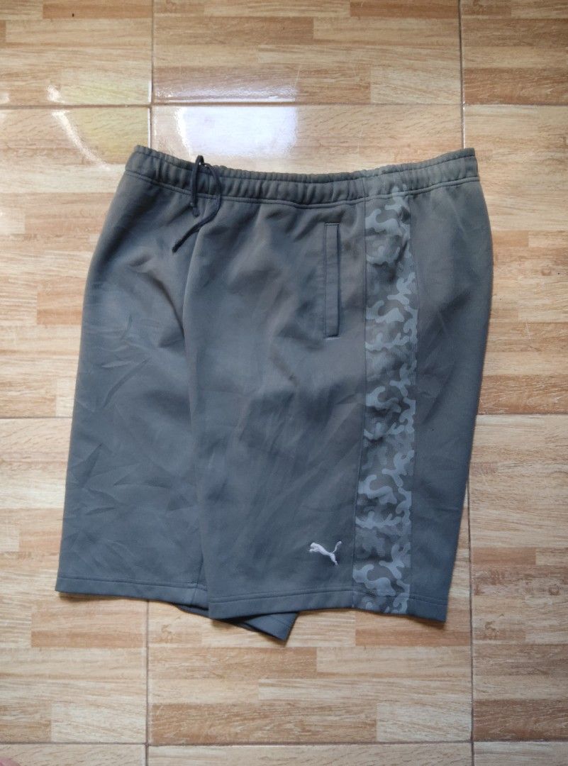 PUMA camo side strip (Category: Shorts) located in San Carlos. Submitted by declutteringv1 (Listing ID 1370126219, Image 1). Description: W freesize L 22 embroidered puma logo pm for more info.