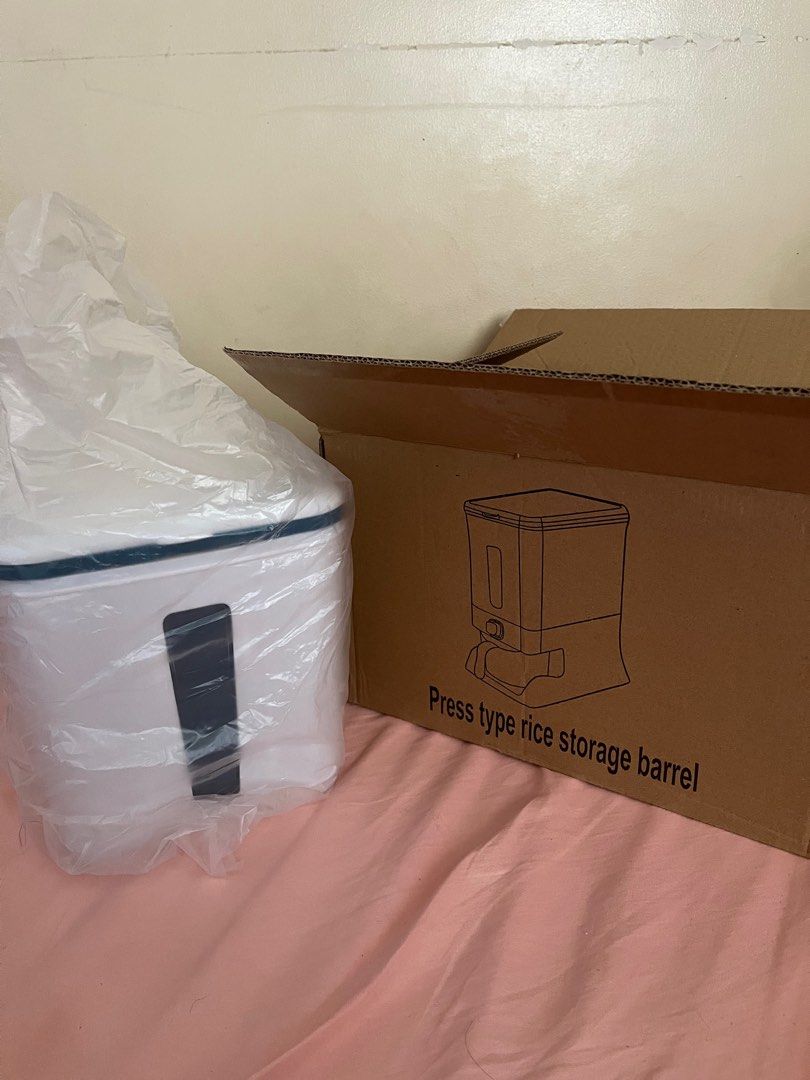 Rice storage container (Category: Food Organization & Storage) located in Muntinlupa City. Submitted by aiyaiyay (Listing ID 1370166005, Image 2). Description: Press type rice storage container Color: Amber Blue Condition: Box opened to check for any damage and for photo; was given as gift but never been used. For meet up and pick up only (grab/lalamove, etc will be shouldered and booked by buyer) .
