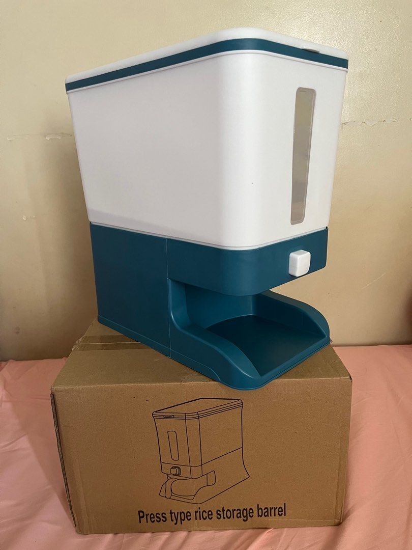 Rice storage container (Category: Food Organization & Storage) located in Muntinlupa City. Submitted by aiyaiyay (Listing ID 1370166005, Image 1). Description: Press type rice storage container Color: Amber Blue Condition: Box opened to check for any damage and for photo; was given as gift but never been used. For meet up and pick up only (grab/lalamove, etc will be shouldered and booked by buyer) .