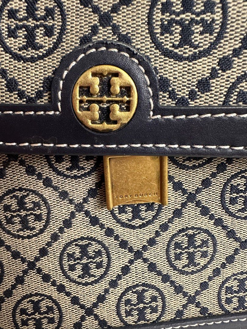 Tory Burch Monogran Shoulder Bag (Category: Luxury Bags & Wallets) located in Pasig City. Submitted by mitchie24 (Listing ID 1370093219, Image 3). Description: Used a few times only. Please see last picture for flaws. Unfortunately, I forgot where I stored the dustbag thus, some scratches at the bottom. .
