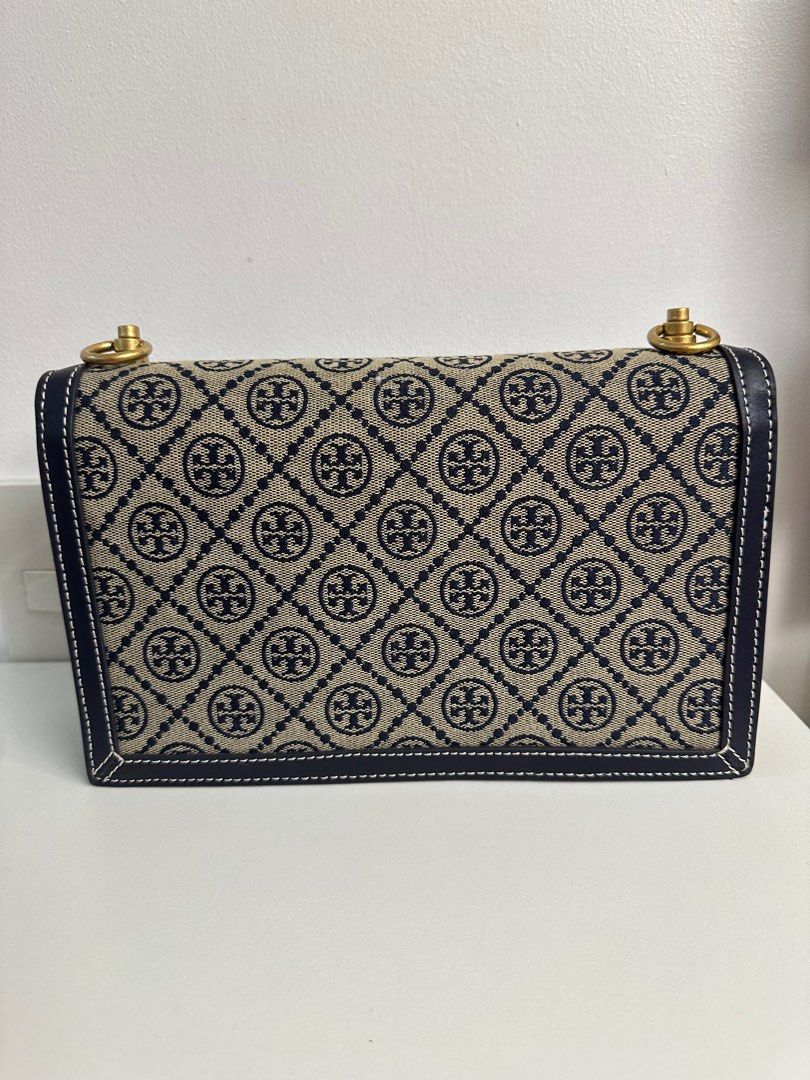 Tory Burch Monogran Shoulder Bag (Category: Luxury Bags & Wallets) located in Pasig City. Submitted by mitchie24 (Listing ID 1370093219, Image 2). Description: Used a few times only. Please see last picture for flaws. Unfortunately, I forgot where I stored the dustbag thus, some scratches at the bottom. .