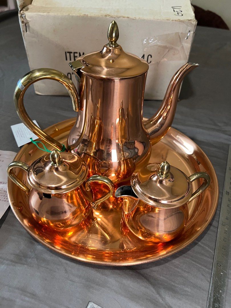 Vintage Copper Coffee/Tea Set (Category: Coffee & Tea Tableware) located in Makati City. Submitted by affordableeleganceemporium (Listing ID 1370084190, Image 3). Description: Vintage Copper Coffee & Tea Set with Tray Elevate your serving experience with this exquisite Vintage Copper Coffee & Tea Set, a timeless ensemble that combines functionality with classic elegance. This complete set includes: Coffee/Teapot: Crafted with a gracefully curved 