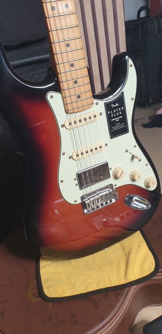 Fender player plus hss sunburts (Category: Musical Instruments) located in General Trias. Submitted by christianlaguerta (Listing ID 1370368399, Image 2). Description: new full set up with elexir 9.42 guage The Fender Player Plus Stratocaster HSS in a 3-tone sunburst finish is a solid-body electric guitar with an HSS pickup configuration (Humbucker-Single-Single). It features a gloss-finished alder body, a 25.5" scale length, and a 22-fret maple 