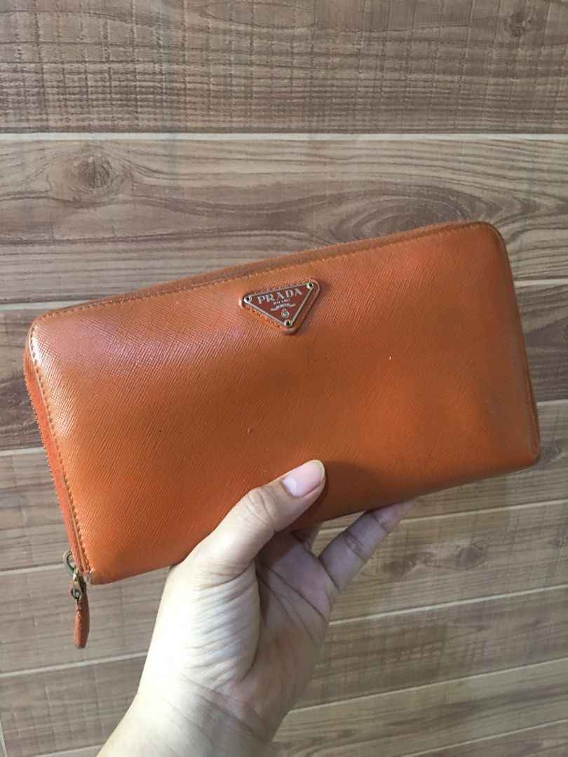 Prada long wallet (Category: Luxury Bags & Wallets) located in Las Pinas. Submitted by lauricontapay (Listing ID 1370336444, Image 1). Description: Selling my preloved authentic prada long wallet withballpen holder and check holder Signs of usage ₱2,000 only All photos Are actual Las piñas area .