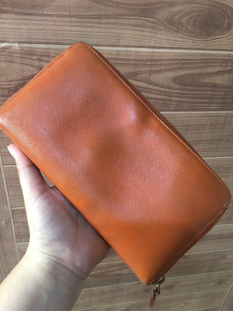 Prada long wallet (Category: Luxury Bags & Wallets) located in Las Pinas. Submitted by lauricontapay (Listing ID 1370336444, Image 3). Description: Selling my preloved authentic prada long wallet withballpen holder and check holder Signs of usage ₱2,000 only All photos Are actual Las piñas area .