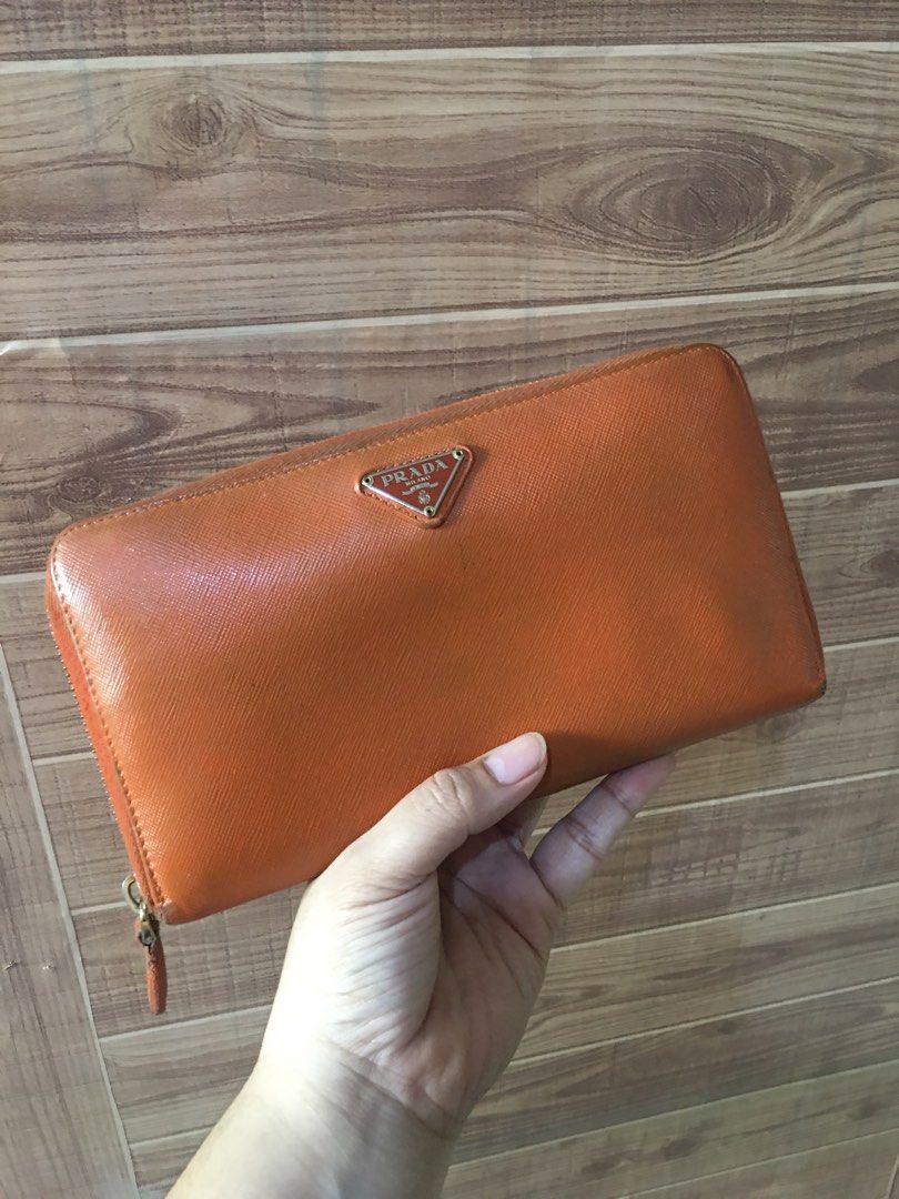 Prada long wallet (Category: Luxury Bags & Wallets) located in Las Pinas. Submitted by lauricontapay (Listing ID 1370336444, Image 2). Description: Selling my preloved authentic prada long wallet withballpen holder and check holder Signs of usage ₱2,000 only All photos Are actual Las piñas area .
