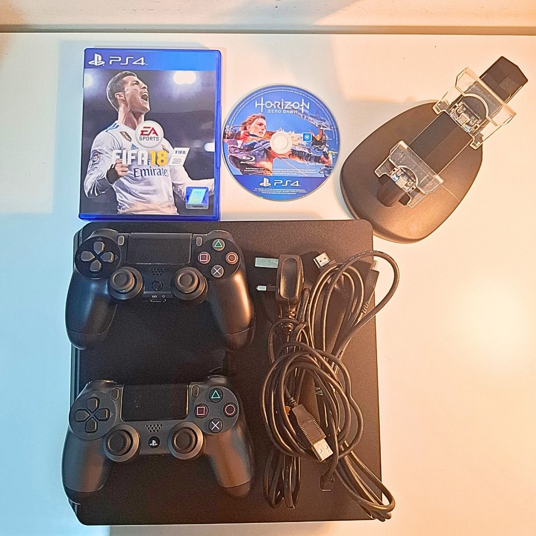 PS4 Bundle – 2 Controllers + 2 Games + Charging Stand – RM800 