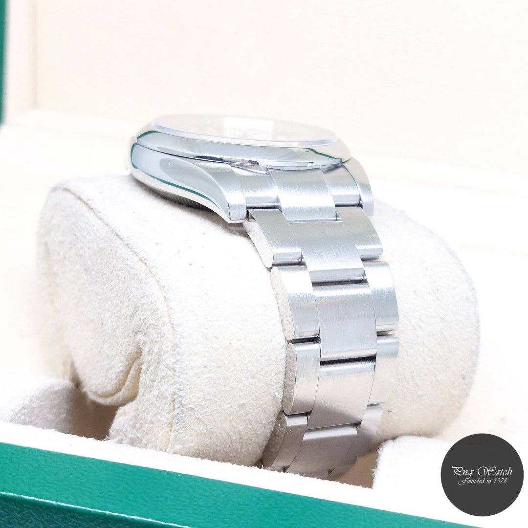 Rolex 34mm Champagne Batons Dial Oyster Perpetual REF: 114200 (Box, Card, Tag-2015) (Category: Watches) located in Singapore. Submitted by pngwatchdealer (Listing ID 1370404819, Image 3). Description: [SPECIFICATIONS] **Watch comes in full option (Box, Card & Tag)** **Straight bracelet** Brand: Rolex Model: Oyster Perpetual (REF: 114200)(AN)(15)(O) Movement: Automatic (Self-Winding) Functions and Features: Hours, Minutes and Seconds (CASE) Case M