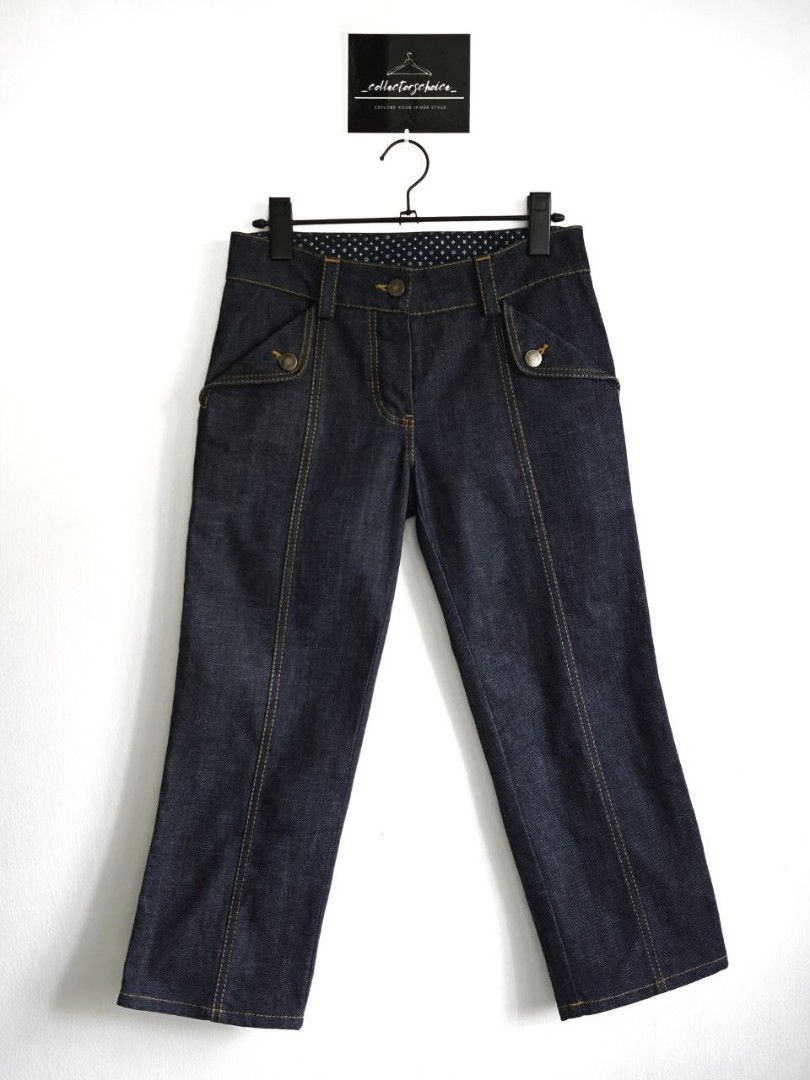 Louis Vuitton Cotton Denim Capri Pants (Category: Luxury Apparel) located in Cavite. Submitted by _collectorschoice_ (Listing ID 1370596287, Image 3). Description: ° Dark blue color with yellow stitching, monogram flower embroidery on the side ° This stylish piece from Louis Vuitton is ideal for casual days ° Made from 100% cotton ° They are styled with contrast stitching ° Button closure and are designed to offer a good fit ° Pair with simple te