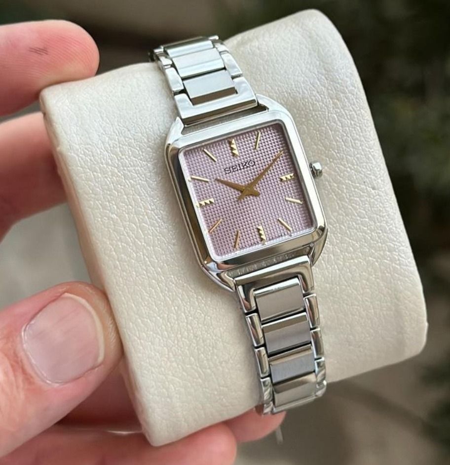 Seiko SWR077P1 Essentials Mauve Pink Grid Pattern Dial Analog Stainless Steel Ladies Dress Watch SWR077 (Category: Women's Watches) located in Singapore. Submitted by kbvkbv (Listing ID 1370595972, Image 1). Description: Watch Information Movement Type : Quartz Precision : ±15 seconds per month Case Size Thickness:6.4mm Diameter:26.0mm Lug-to-lug:34.8mm Crystal : Hardlex Clasp : Three-fold clasp with push button release Distance between lugs : 15