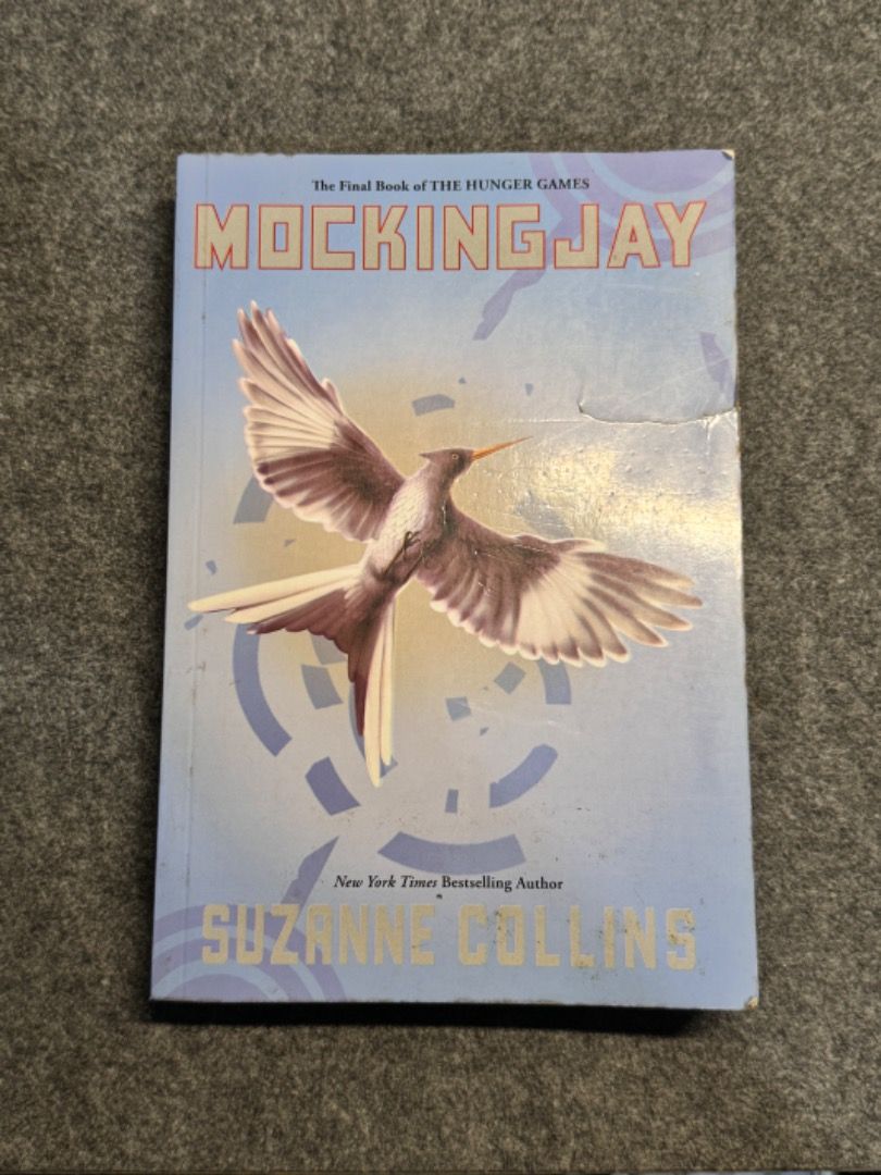 The Hunger Games: Mockingjay (Paperback) (Category: Storybooks) located in Caloocan City. Submitted by thenookofeli (Listing ID 1370603011, Image 1). Description: Hunger Games: Mockingjay by Suzanne Collins Condition: Lightly Used - Paperback - Foxing edges - The cover is slightly torn - Tanned pages but all intact RFS: Extra Copy.