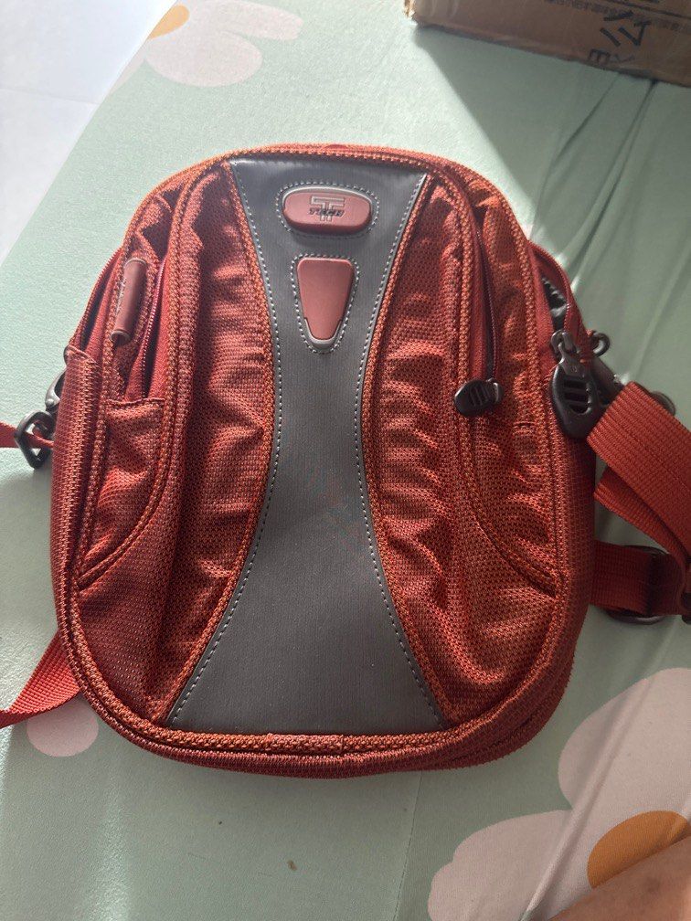 Tumi sling pouch (Category: Bags & Wallets) located in Singapore. Submitted by whyme66 (Listing ID 1370449938, Image 1). Description: Very useful sling bag with lots of compartment for passport, credits cards and wallet. .