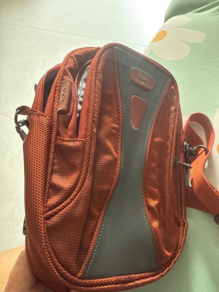Tumi sling pouch (Category: Bags & Wallets) located in Singapore. Submitted by whyme66 (Listing ID 1370449938, Image 3). Description: Very useful sling bag with lots of compartment for passport, credits cards and wallet. .